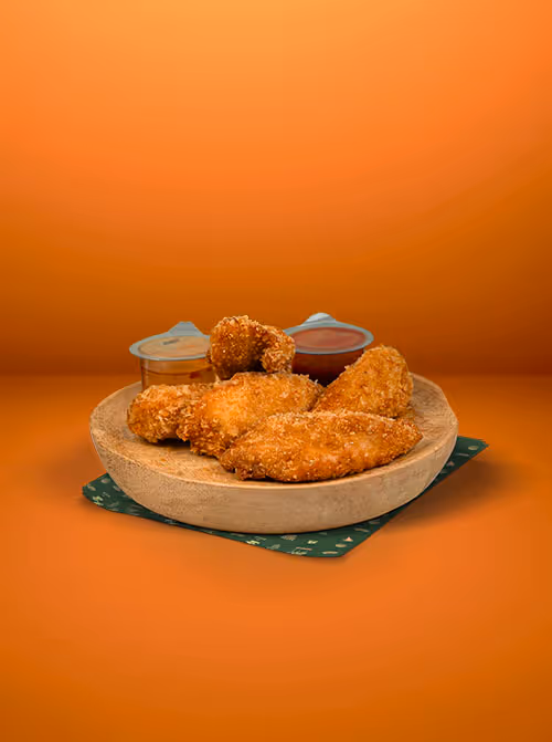 Tenders de poulet croustillants — filets de poulet marinés, panure dorée, intérieur moelleux, servis avec sauce barbecue ou mayo épicée, accompagnement gourmand — Krousty Sabaïdi.